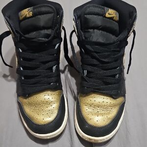 Nike High-Top Black and Gold Retro Air Jordan Sneakers